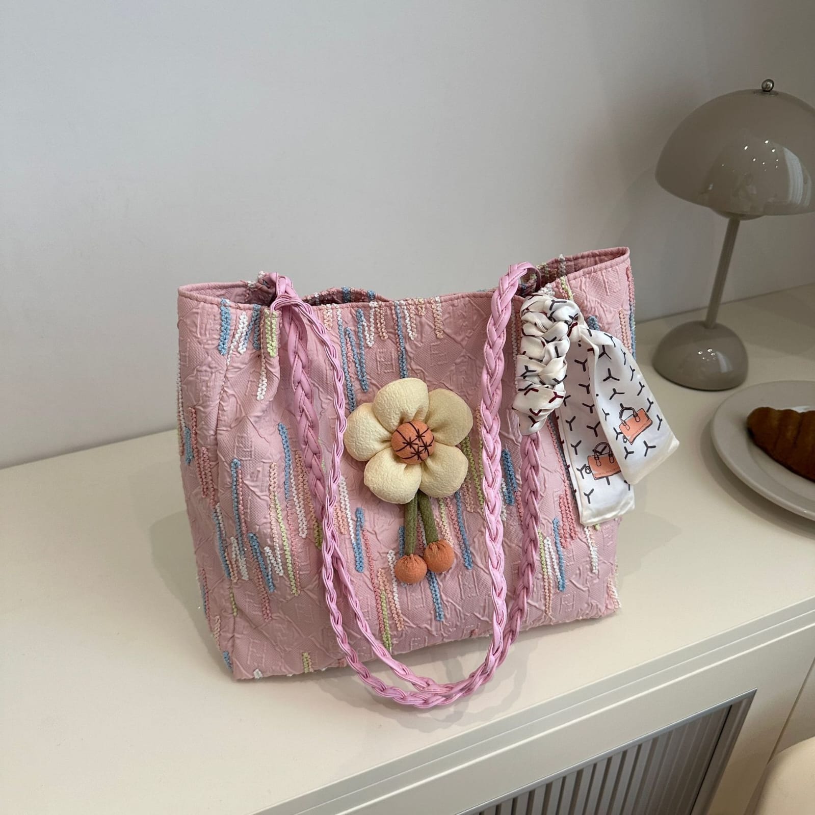 TRENDBUY pink floral charm tote bag with braided strap, displayed on a white surface