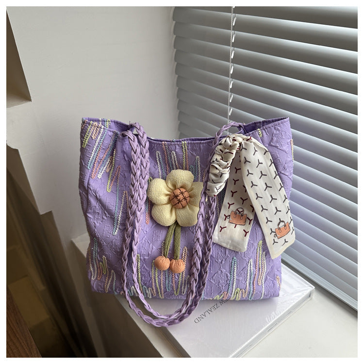 TRENDBUY purple floral charm tote bag with braided strap, positioned on a windowsill