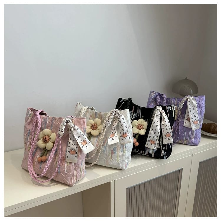Collection of TRENDBUY floral charm tote bags in pink, white, black, and purple colors