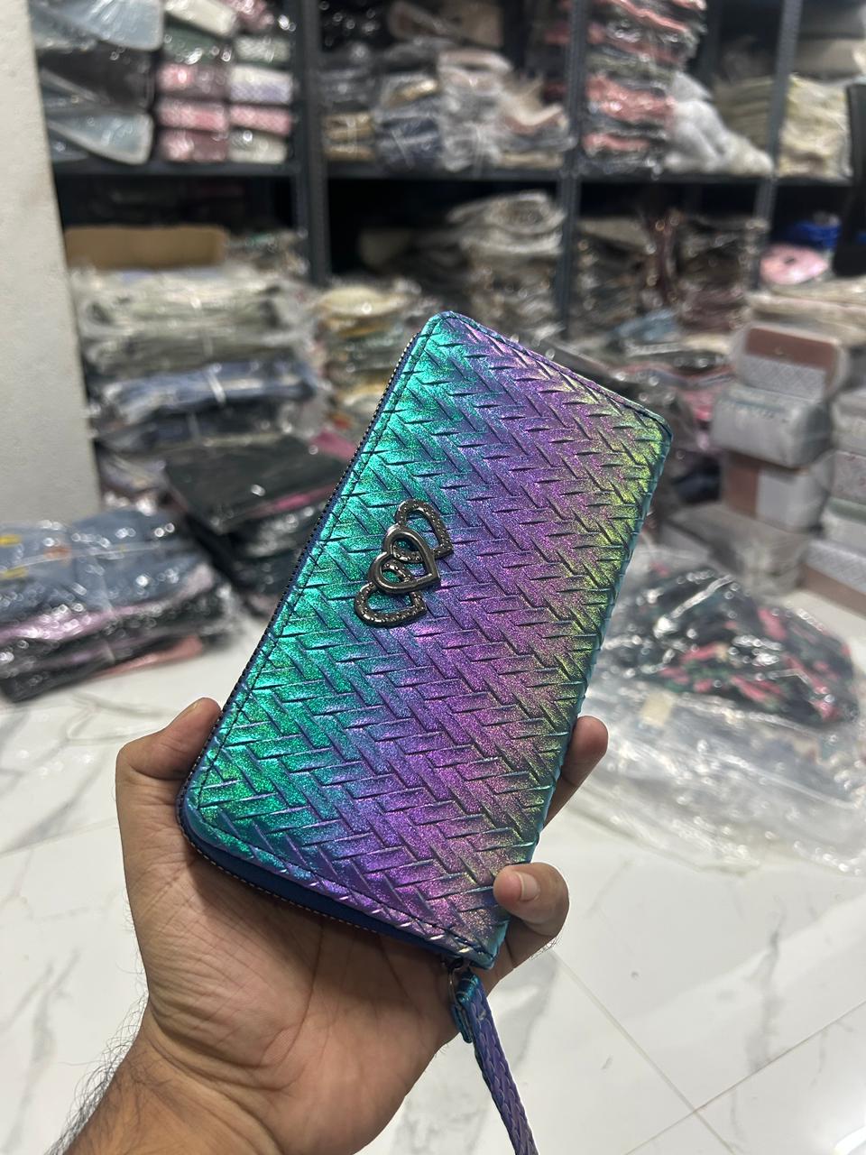 Vibrant TRENDBUY Dhup Chhao wallet showing a full spectrum of rainbow iridescent colors – pink, purple, blue, green.