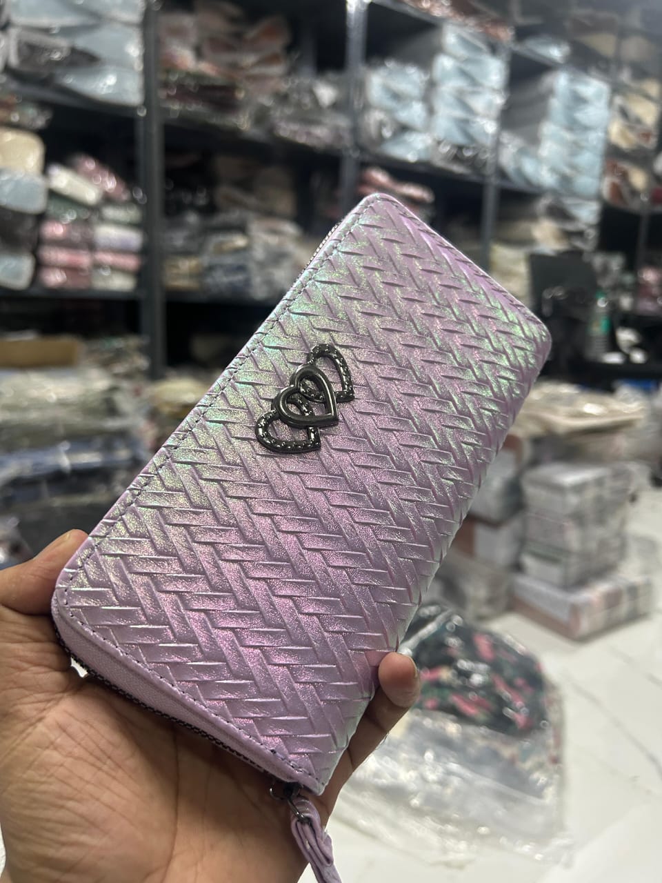 TRENDBUY women's zipper wallet in Iridescent Lavender, highlighting its unique sheen and heart logo.
