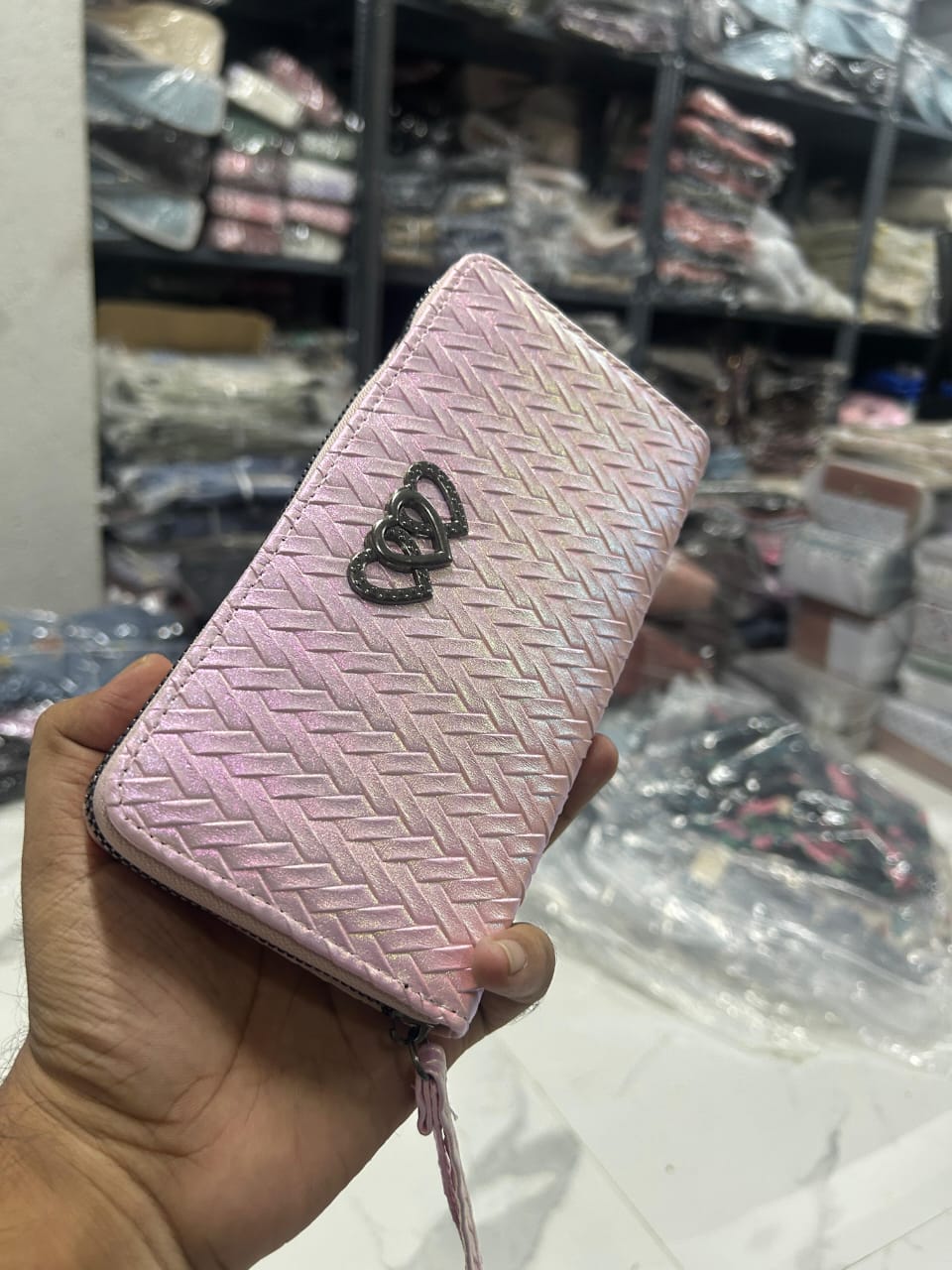 TRENDBUY Dhup Chhao wallet in a soft Iridescent Pink, captured with a subtle glow.