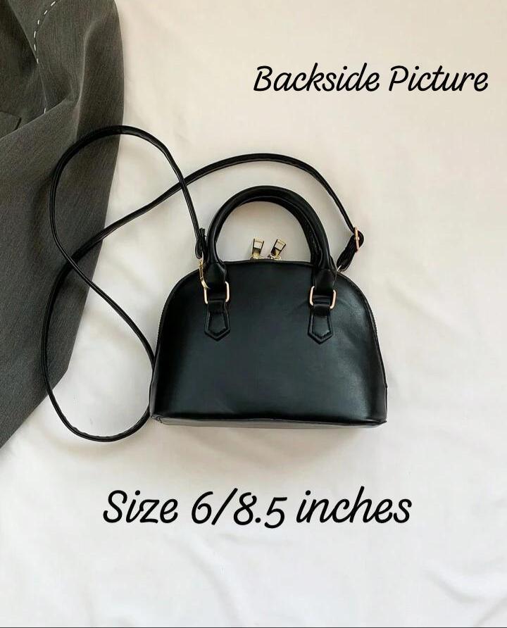 Backside view of the black geometric Bao Bao dome handbag, revealing a solid black back and the approximate size of 6 by 8.5 inches