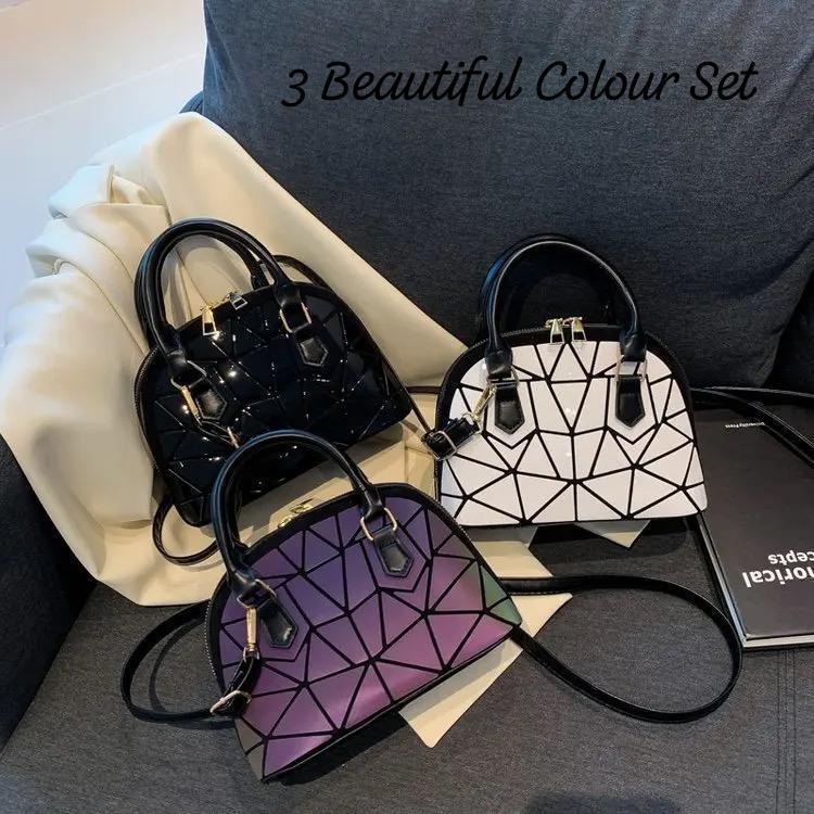 Collection of three TRENDBUY geometric Bao Bao handbags in black, white, and iridescent, arranged together to show the beautiful color set