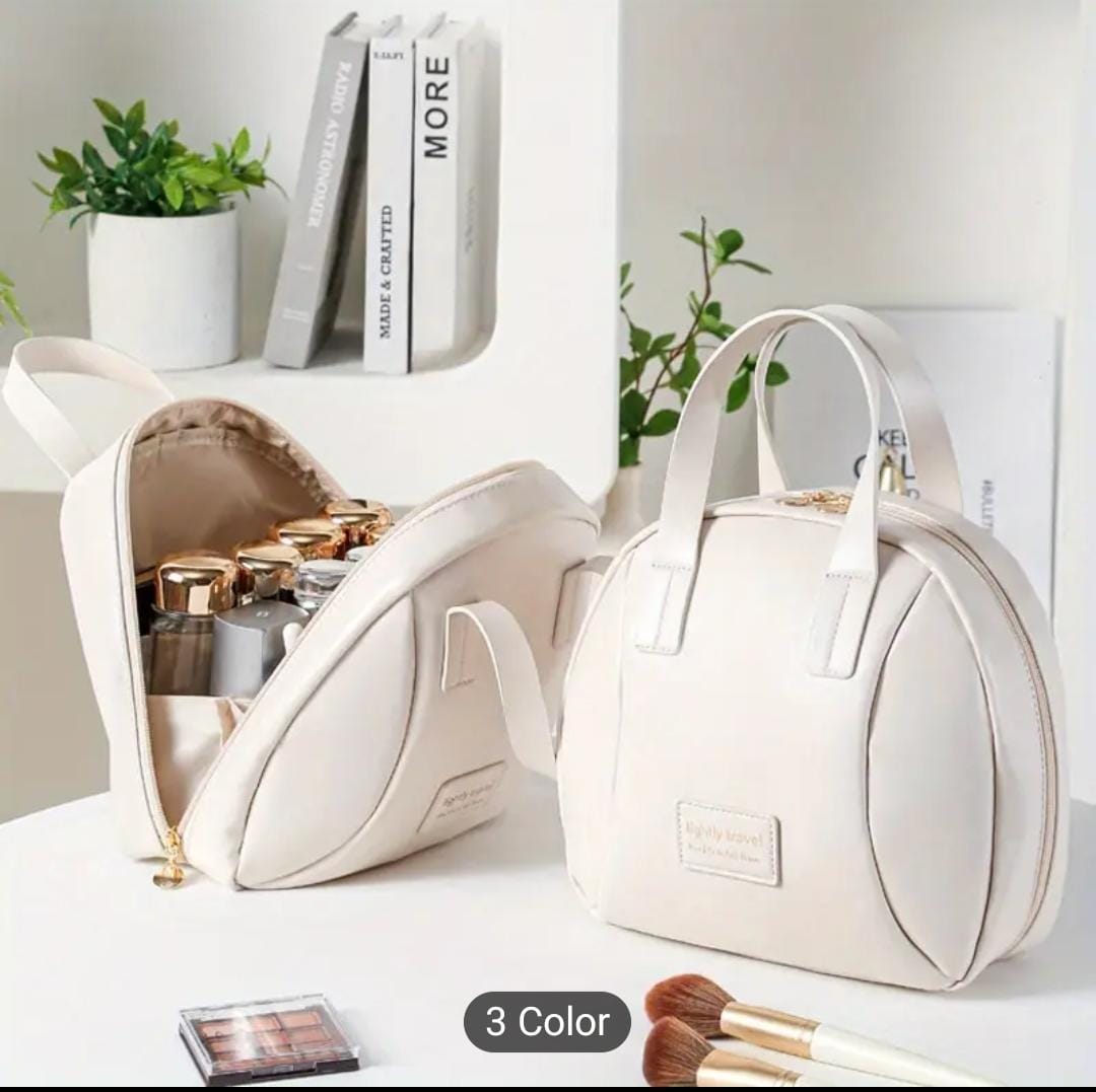 Two white PU leather travel cosmetic bags on a vanity, one open revealing organized makeup bottles and brushes.