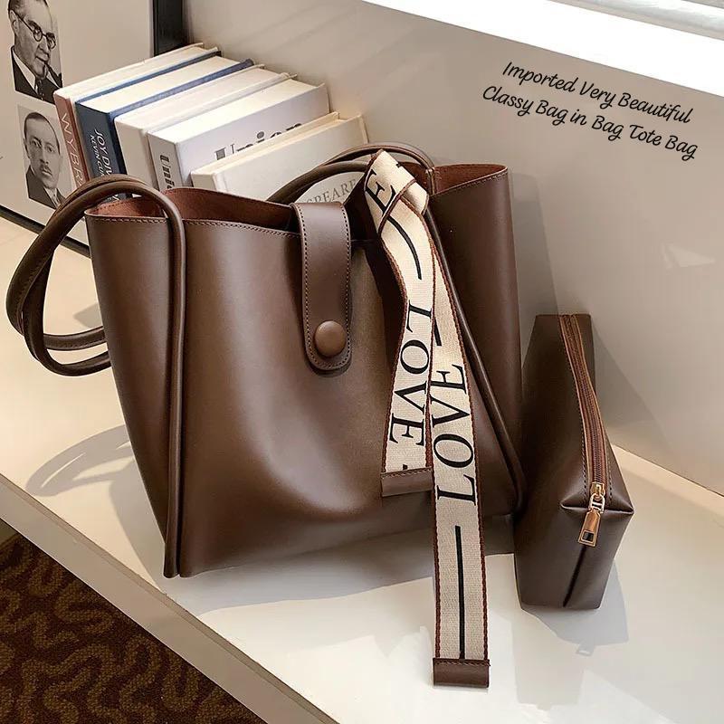 TRENDBUY elegant brown 2-piece PU leather tote bag set with matching pouch and decorative 'LOVE' strap, displayed on a shelf.