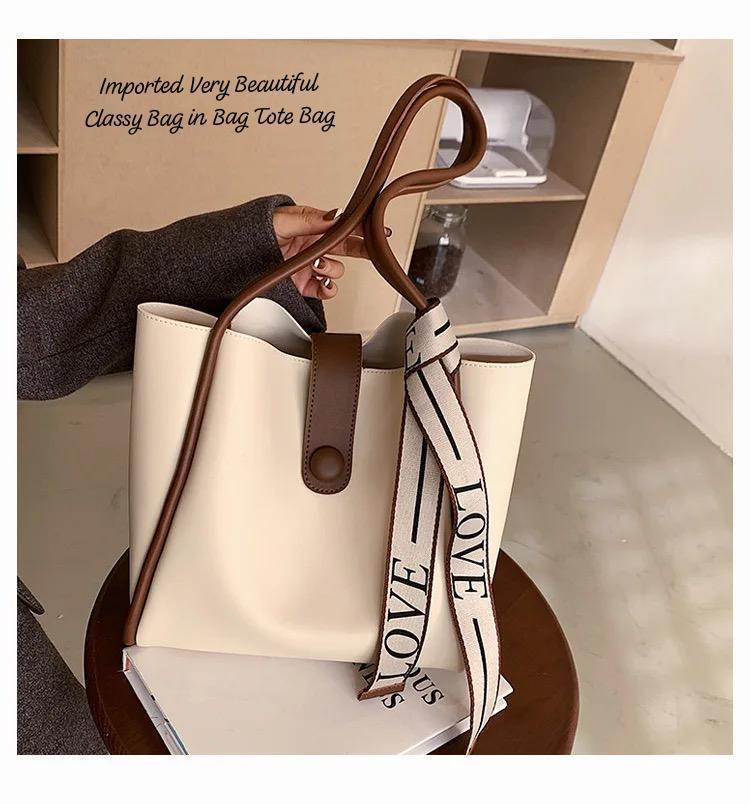 TRENDBUY sophisticated cream 2-piece PU leather tote bag set with matching pouch and a chic 'LOVE' strap, presented on a light surface.