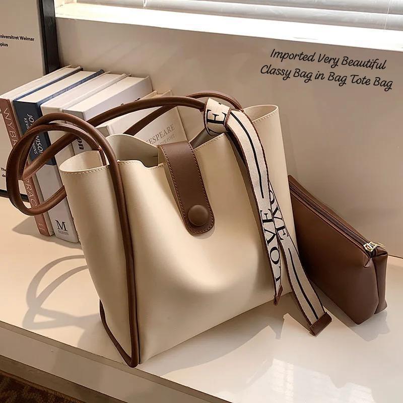 TRENDBUY versatile cream 2-piece PU leather tote bag set from an angle, highlighting its smooth finish and contrasting brown handles.