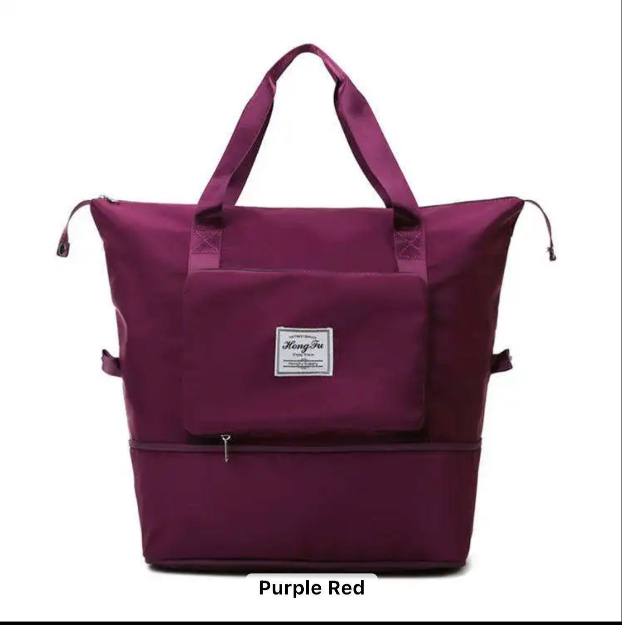 Maroon foldable travel bag in expanded view, showcasing front pocket.