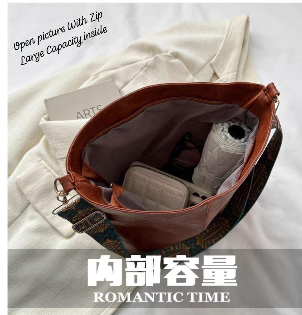 Interior view of an open brown TRENDBUY PU leather tote bag revealing a large capacity, holding a wallet, umbrella, and sunglasses.