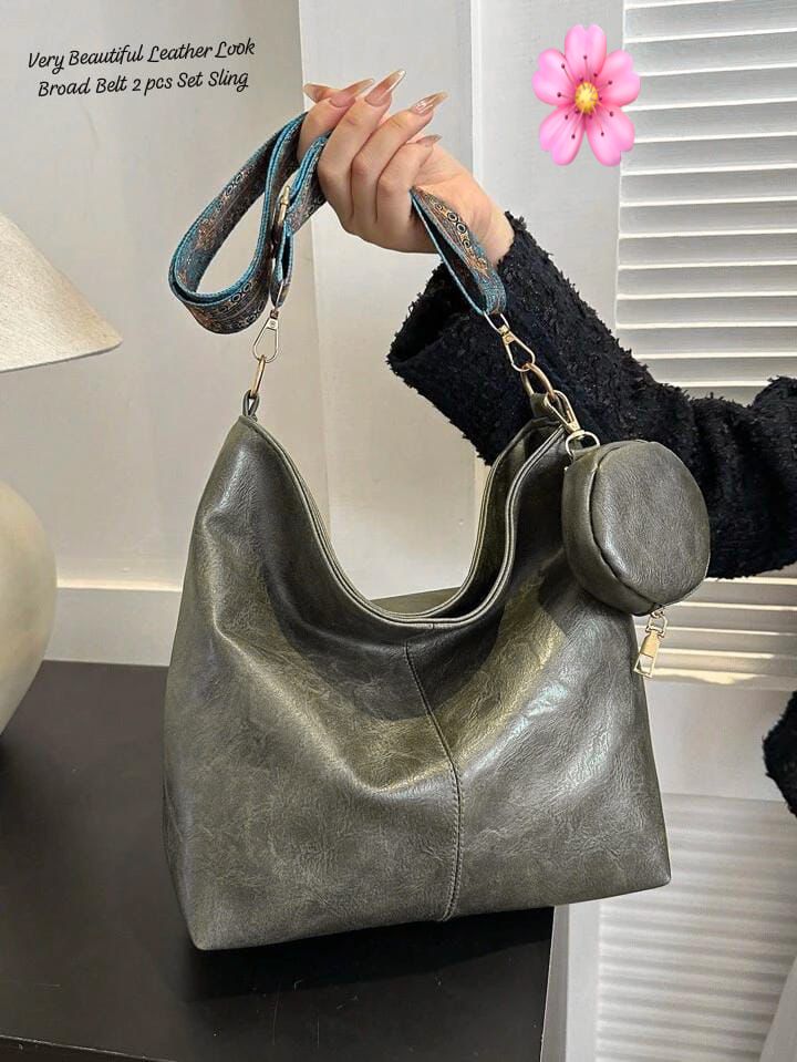 Stylish gray TRENDBUY PU leather tote bag with an attached coin pouch, held by a person in a black sweater on a dark surface.