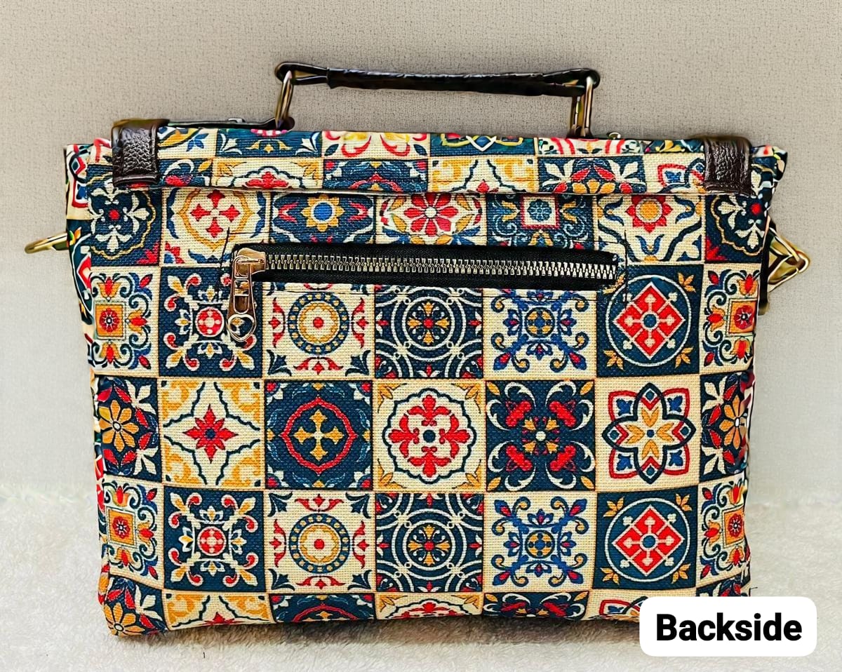 Backside view of the TRENDBUY Ikkat Cotton Sling Bag in the multicolor tile mosaic pattern, clearly showing the functional back zipper pocket.