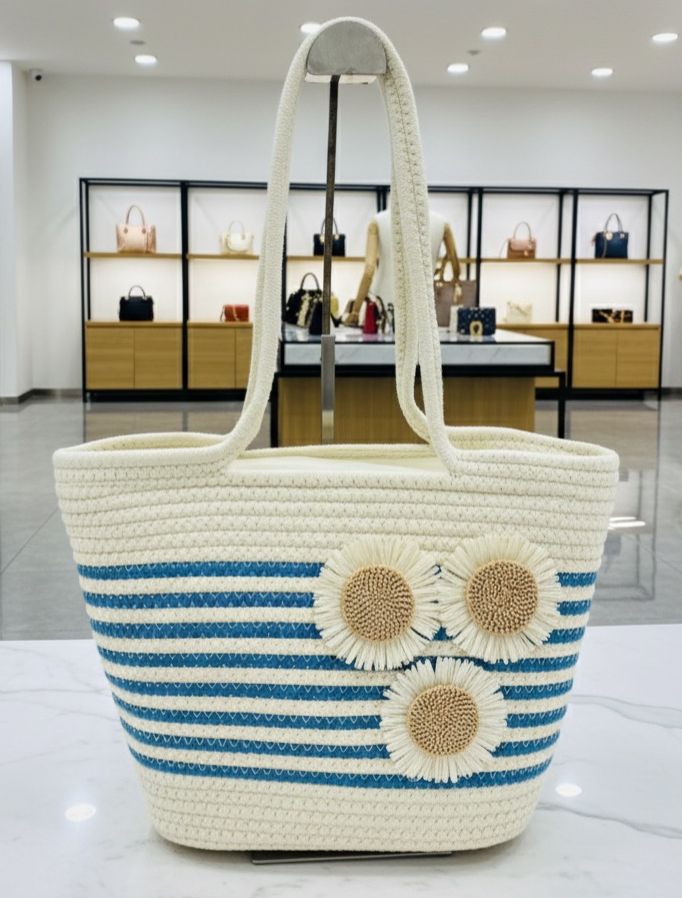 TRENDBUY Sunflower Stripe Handbag featuring blue stripes and three straw sunflower embellishments.