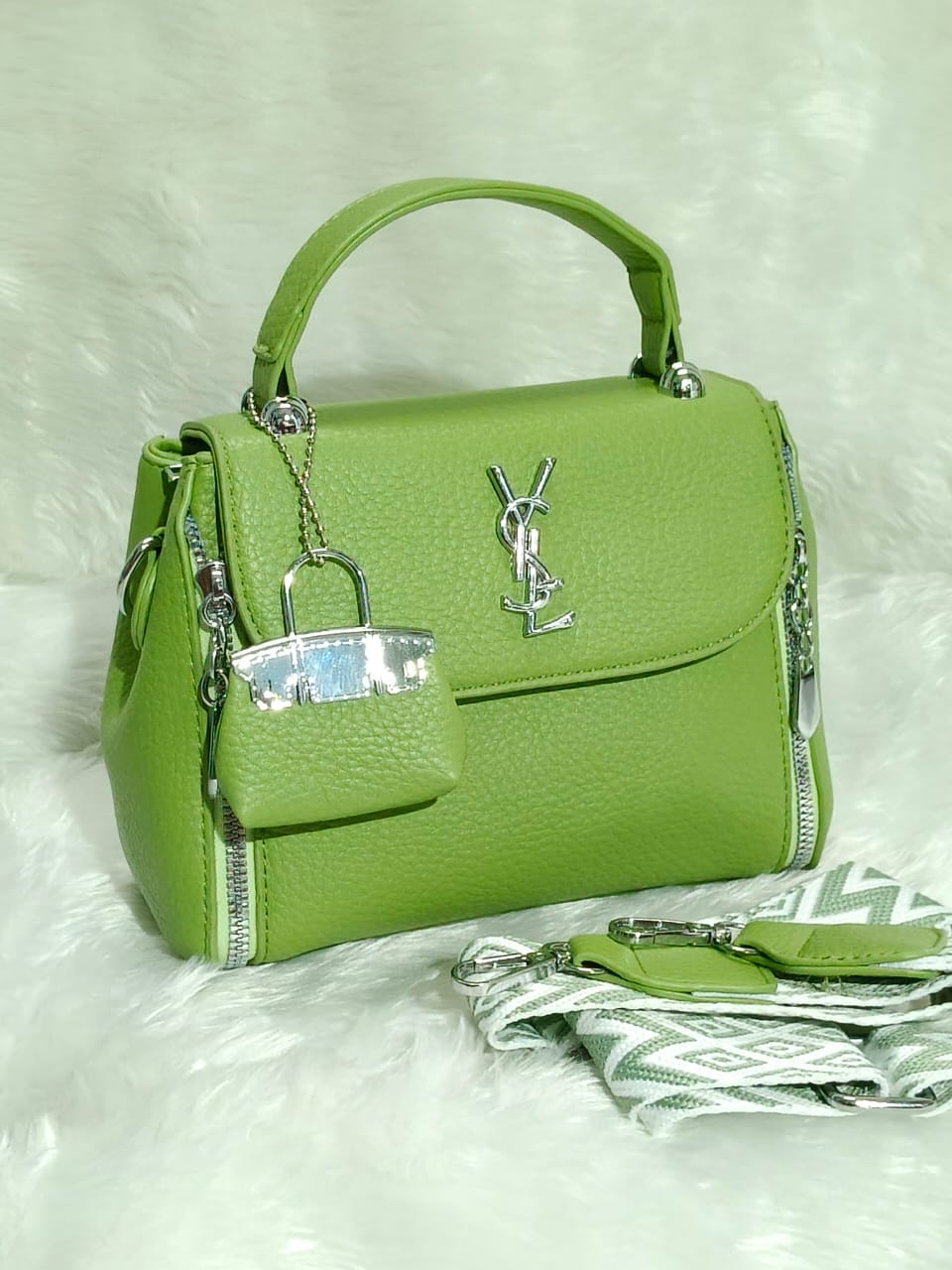Vibrant lime green TRENDBUY YSL-inspired designer sling bag, showcasing its elegant structure, silver branding, and matching patterned strap.