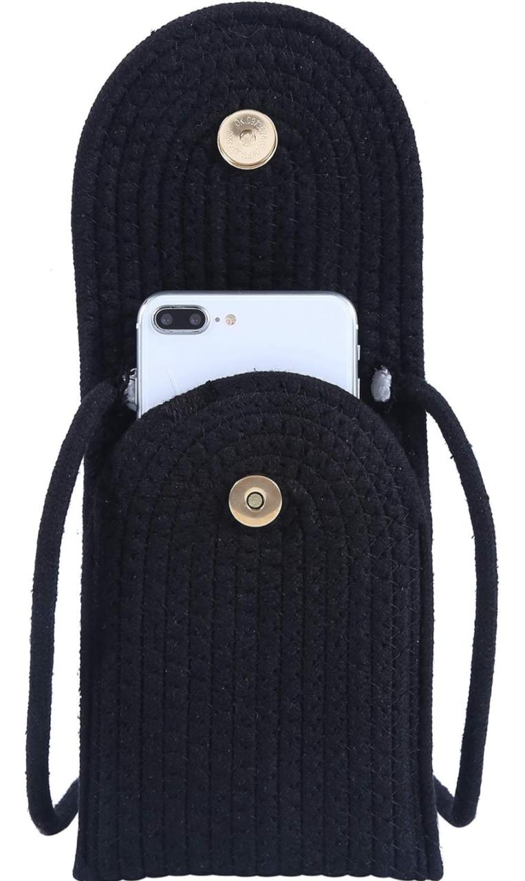 Inside view of a black braided phone bag, showing a smartphone held securely with a magnetic button closure.