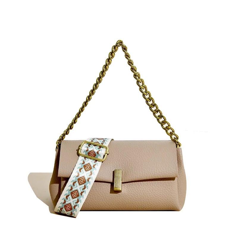 Beige TRENDBUY sling bag with a gold chain handle and a coordinating broad patterned strap, styled against a simple white backdrop.