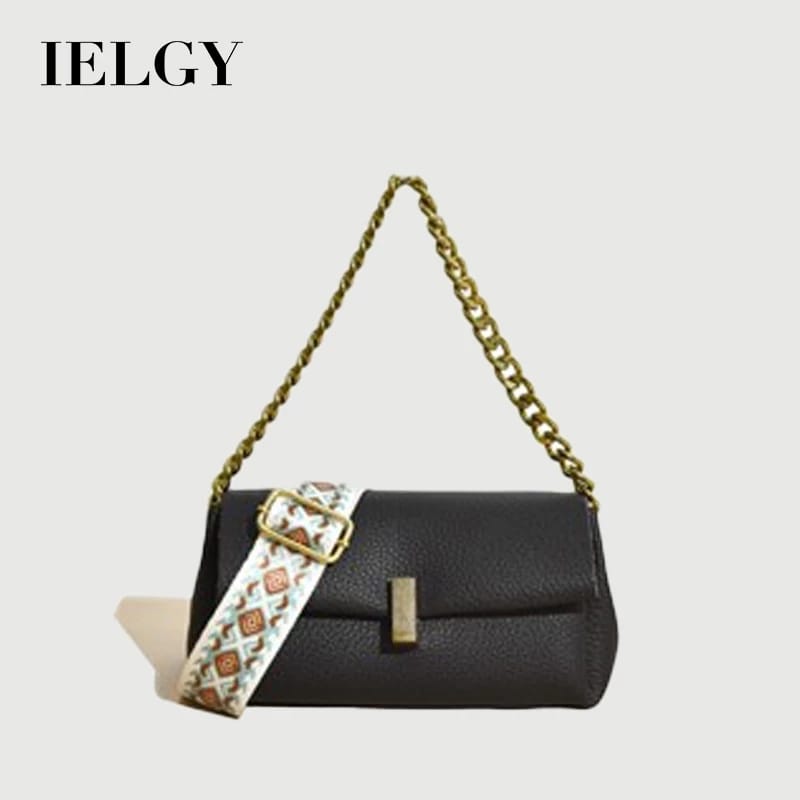 Black TRENDBUY sling bag featuring the 'IELGY' logo, a gold chain handle, and an eye-catching broad patterned strap.