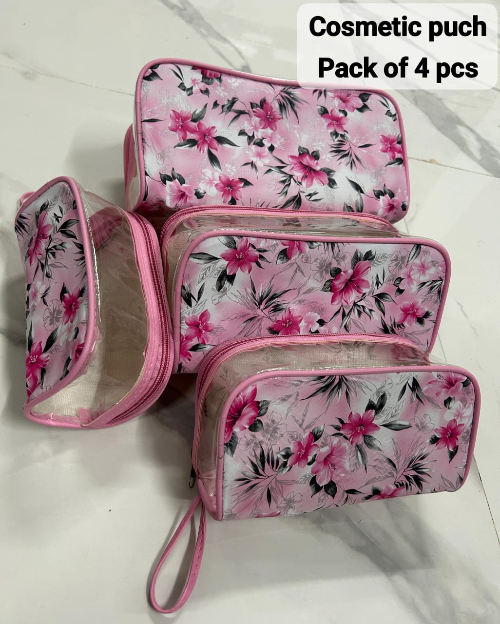 TRENDBUY 4-piece transparent cosmetic pouch set with pink floral print and pink trim.