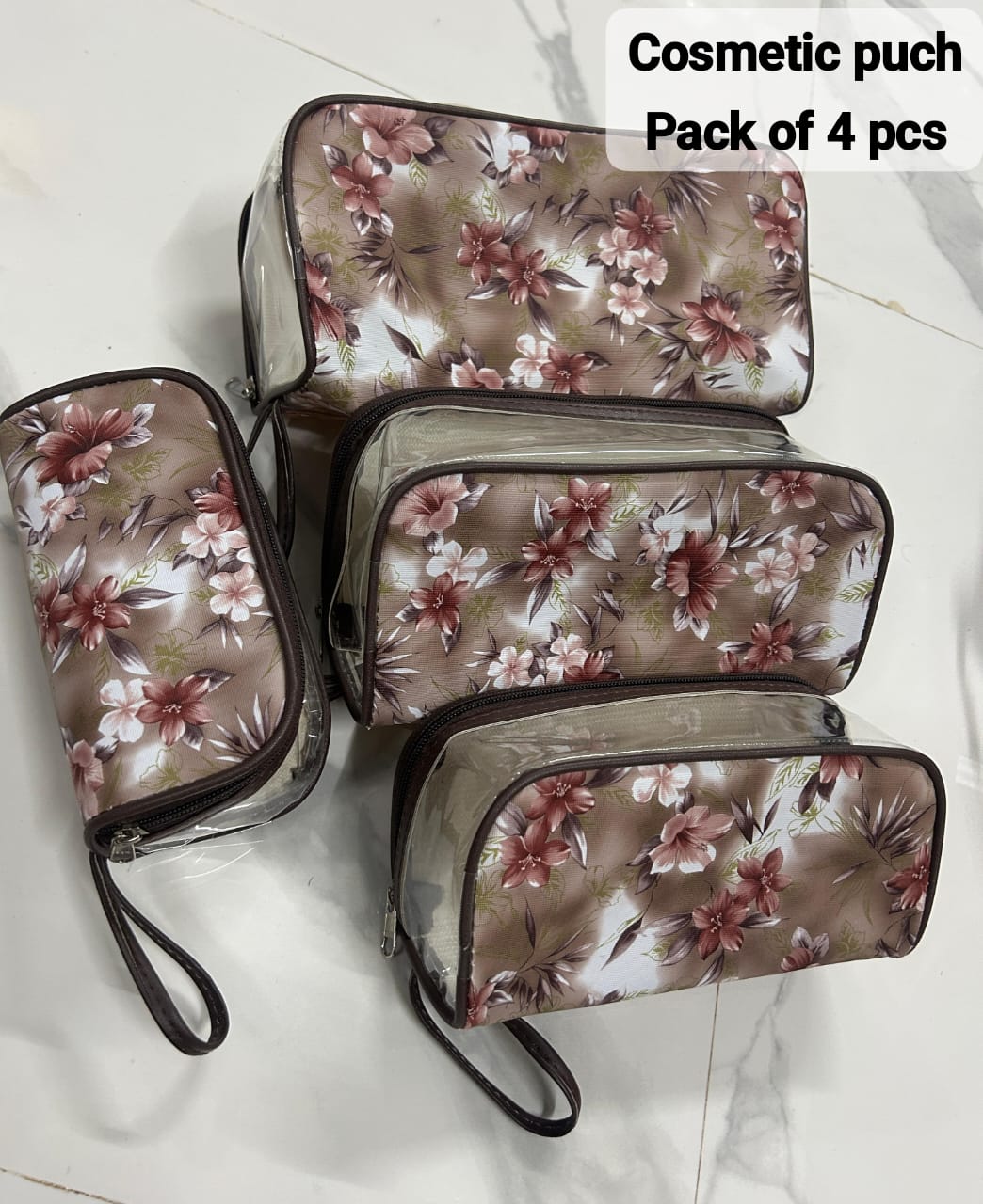 TRENDBUY 4-piece clear make-up bags with brown floral pattern and matching brown trim.