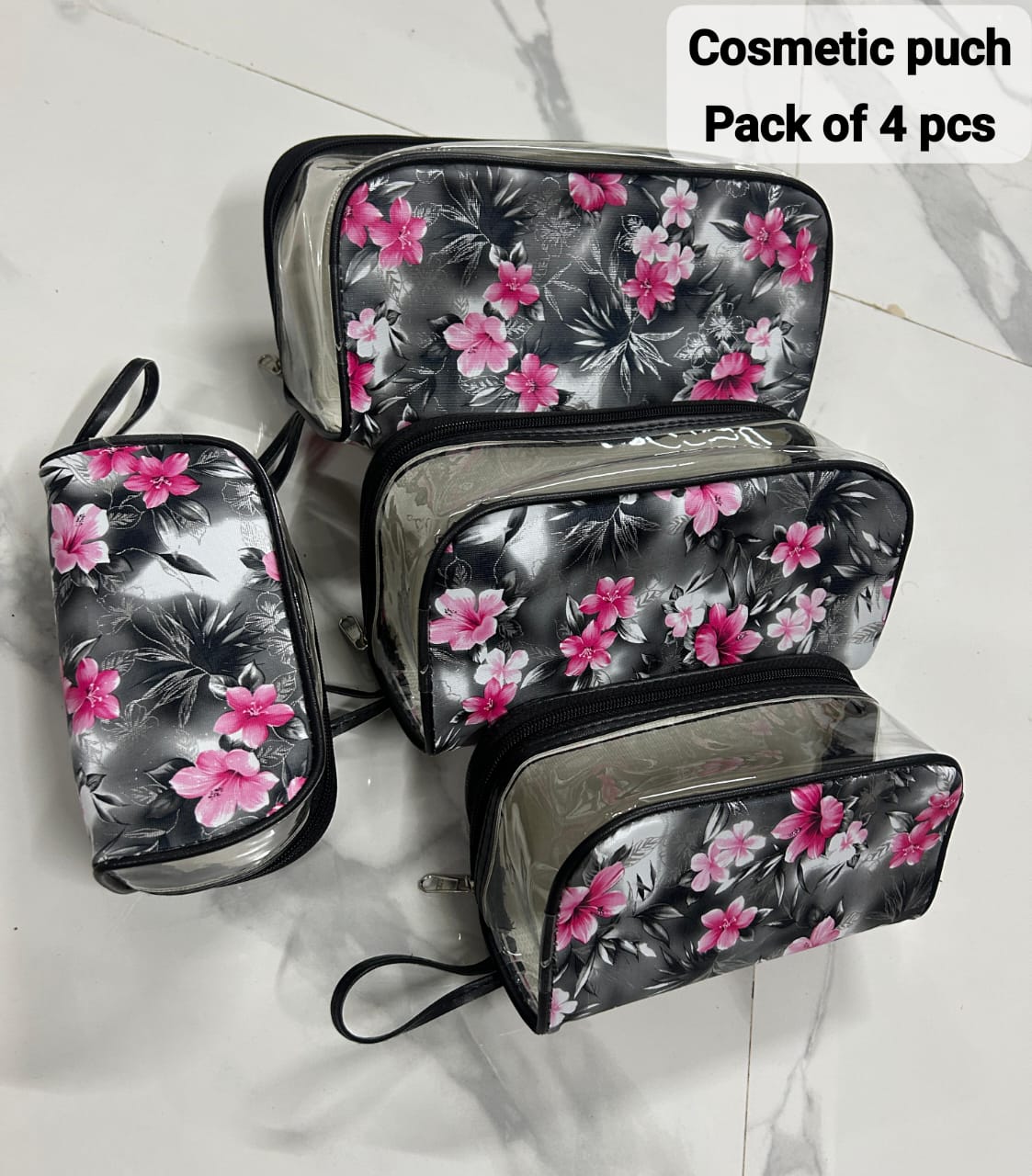 TRENDBUY 4-piece transparent toiletries bags with grey and pink floral print, featuring black trim.