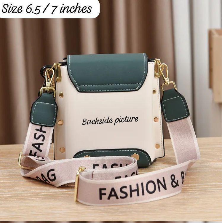 Backside view of the TRENDBUY teal and white broad belt sling bag, showcasing its plain back panel, gold stud accents, and the broad 'FASHION BAG' strap.