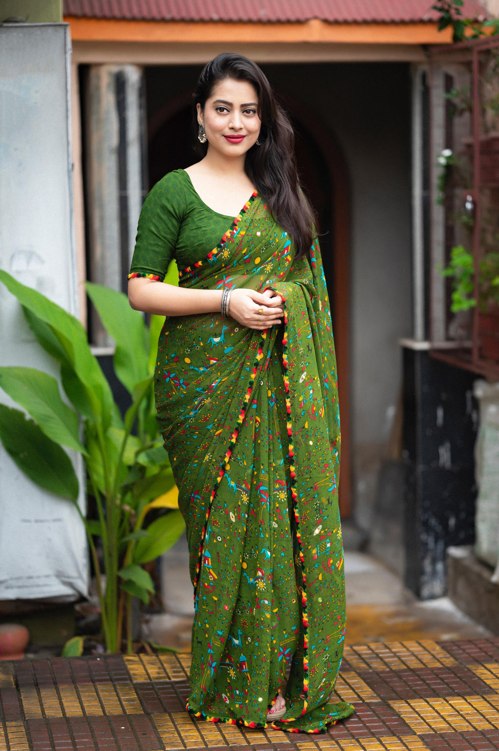 Worli Printed Soft Georgette Saree, elegantly draped, featuring traditional tribal patterns.