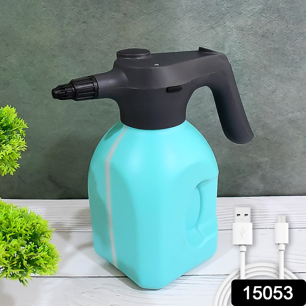 Person using 2L automatic electric spray bottle garden sprayer to water indoor plant.