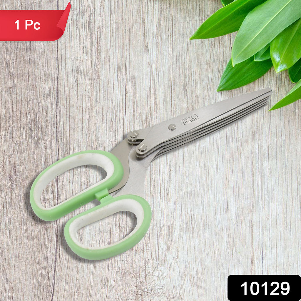 Hand using multifunction 5-blade stainless steel herb scissors to cut fresh herbs into a bowl.