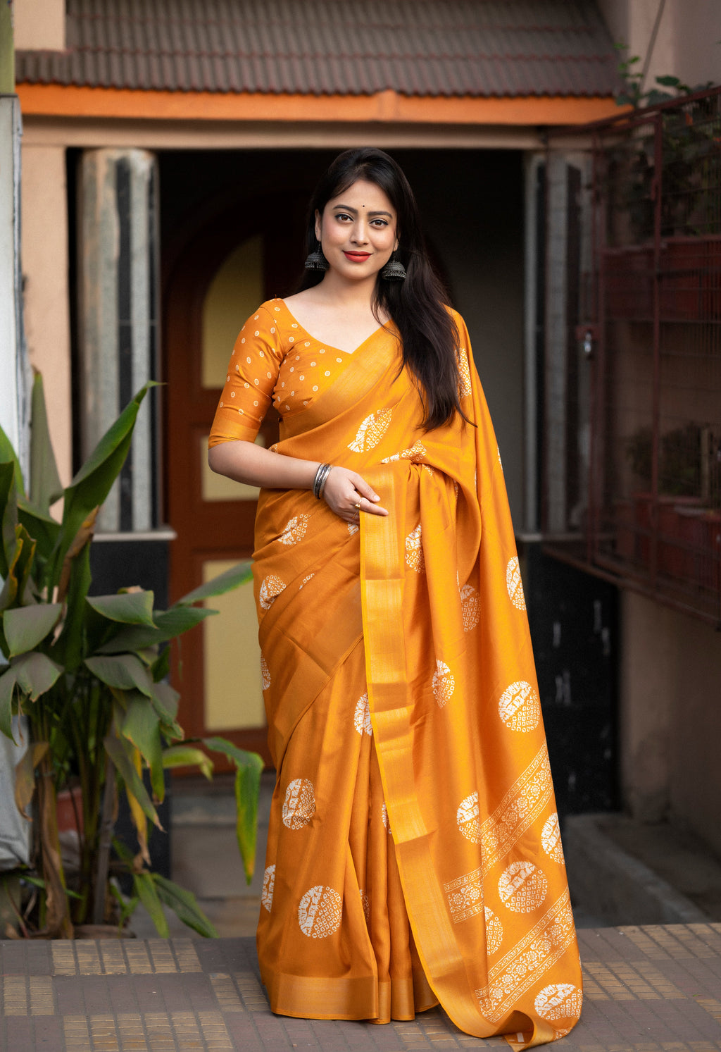 Vibrant yellow batik printed cotton sari with intricate pattern design