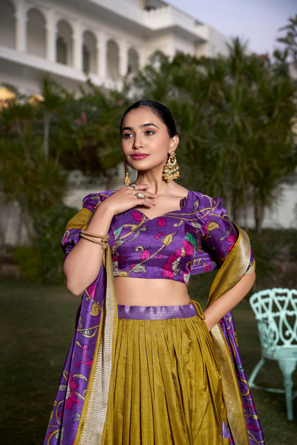 Close-up of the intricate gold Zari weaving border on the yellow silk lehenga skirt