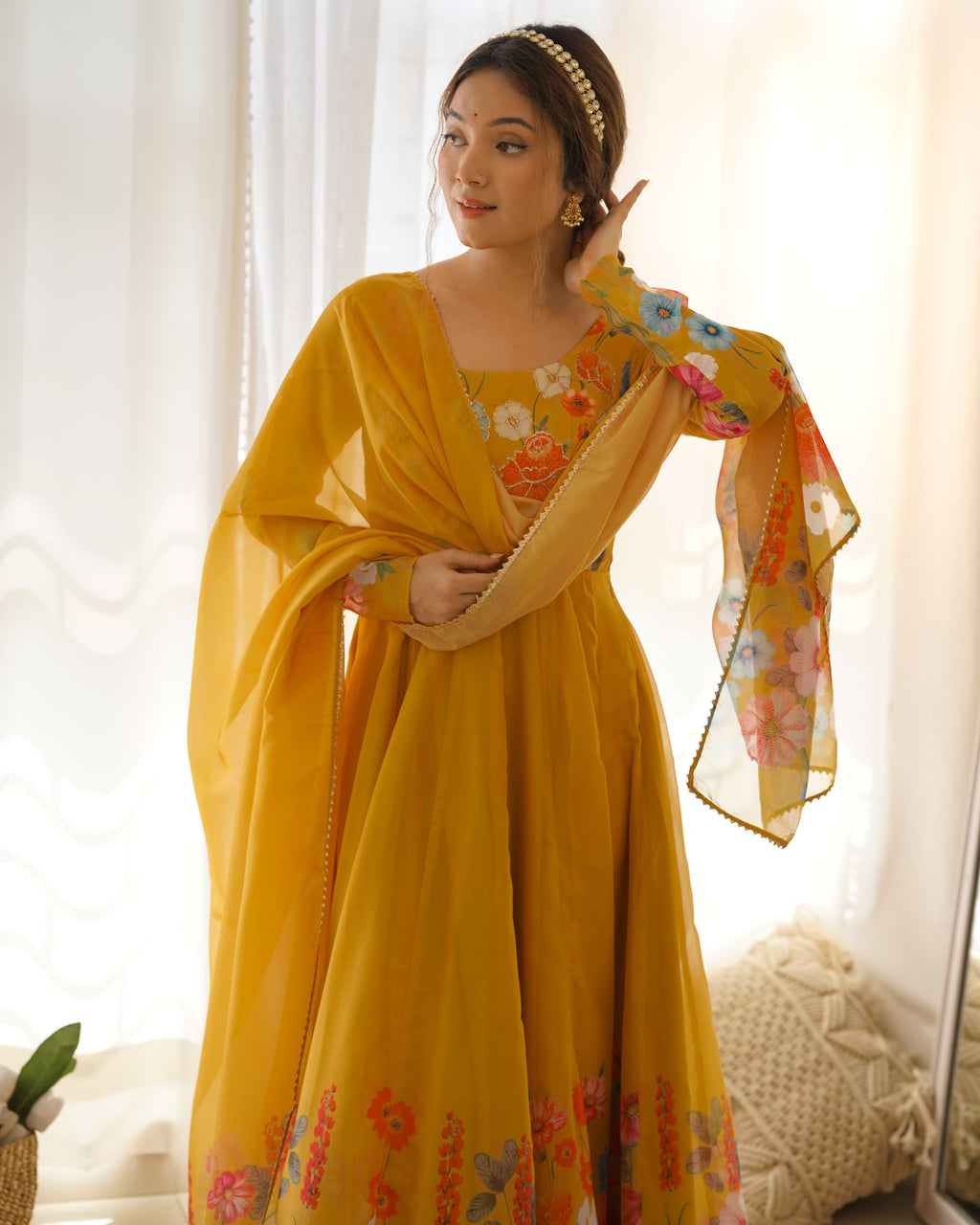 Elegant yellow floral anarkali suit set with matching pants and dupatta.