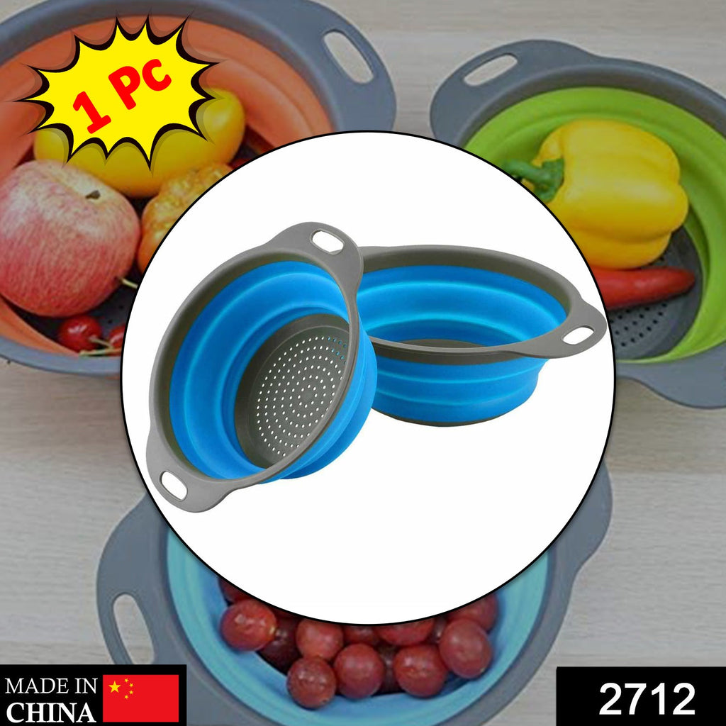 2712 round red foldable silicone strainer in a kitchen sink, ideal for household and official kitchen purposes.