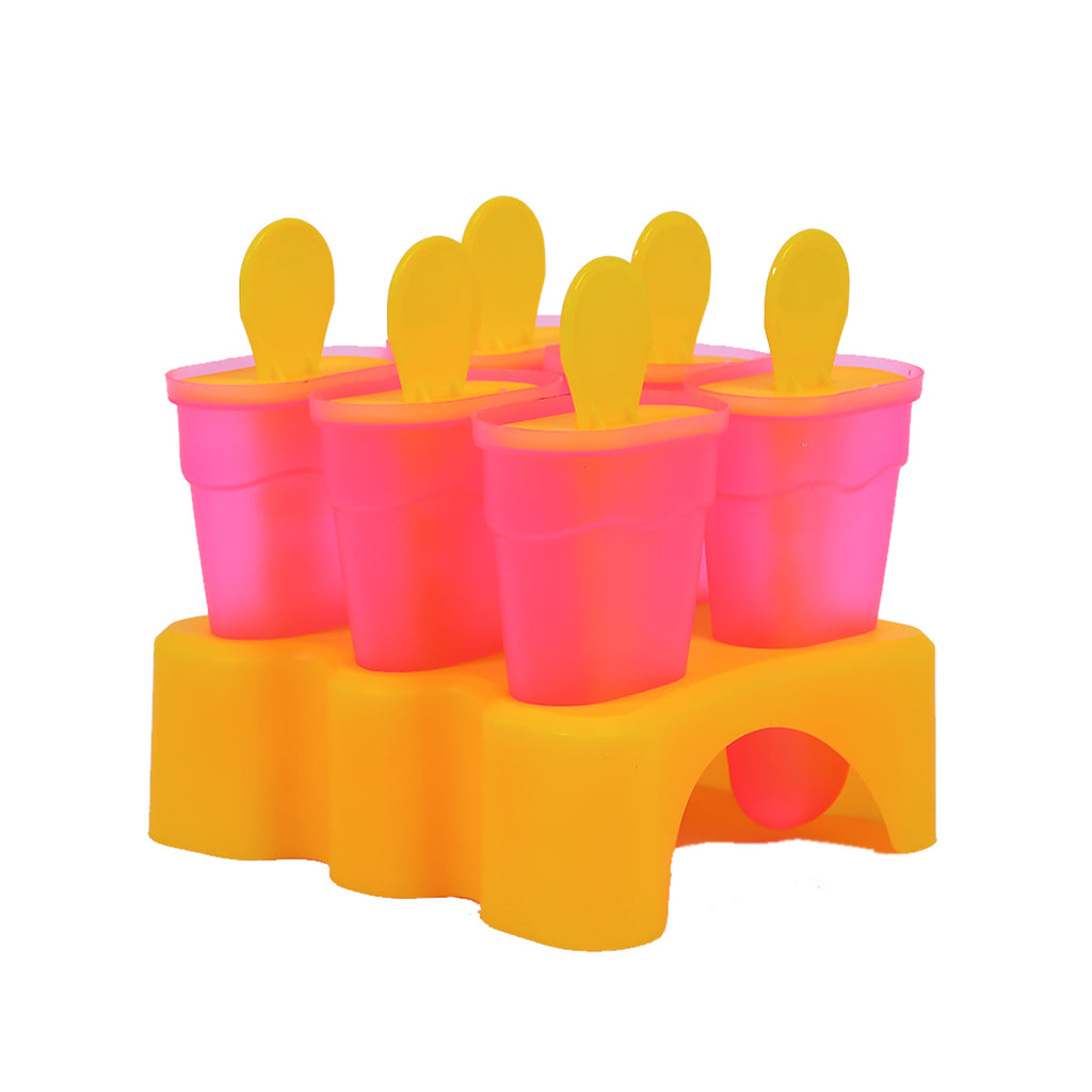 Close-up of six pastel-colored plastic dessert moulds arranged neatly in a green holding stand
