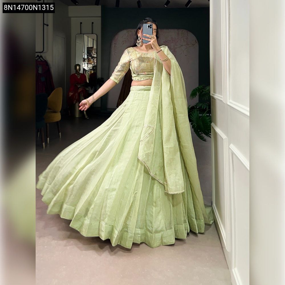 TRENDBUY Allen Crush Lehenga Set in Tea Green, full body front view, model posing dynamically to show flair