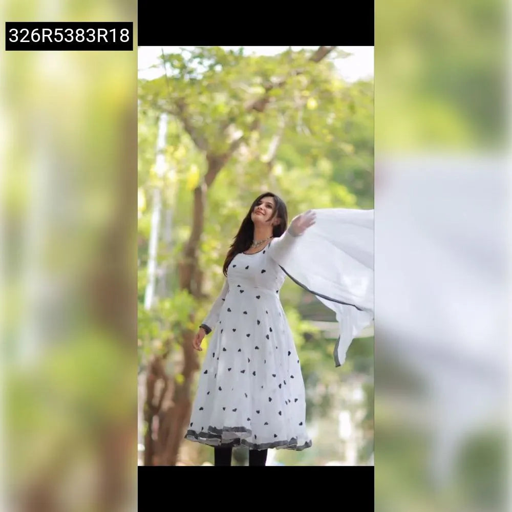Elegant White Georgette Anarkali Gown for women with black heart embroidery, modeled outdoors by TRENDBUY