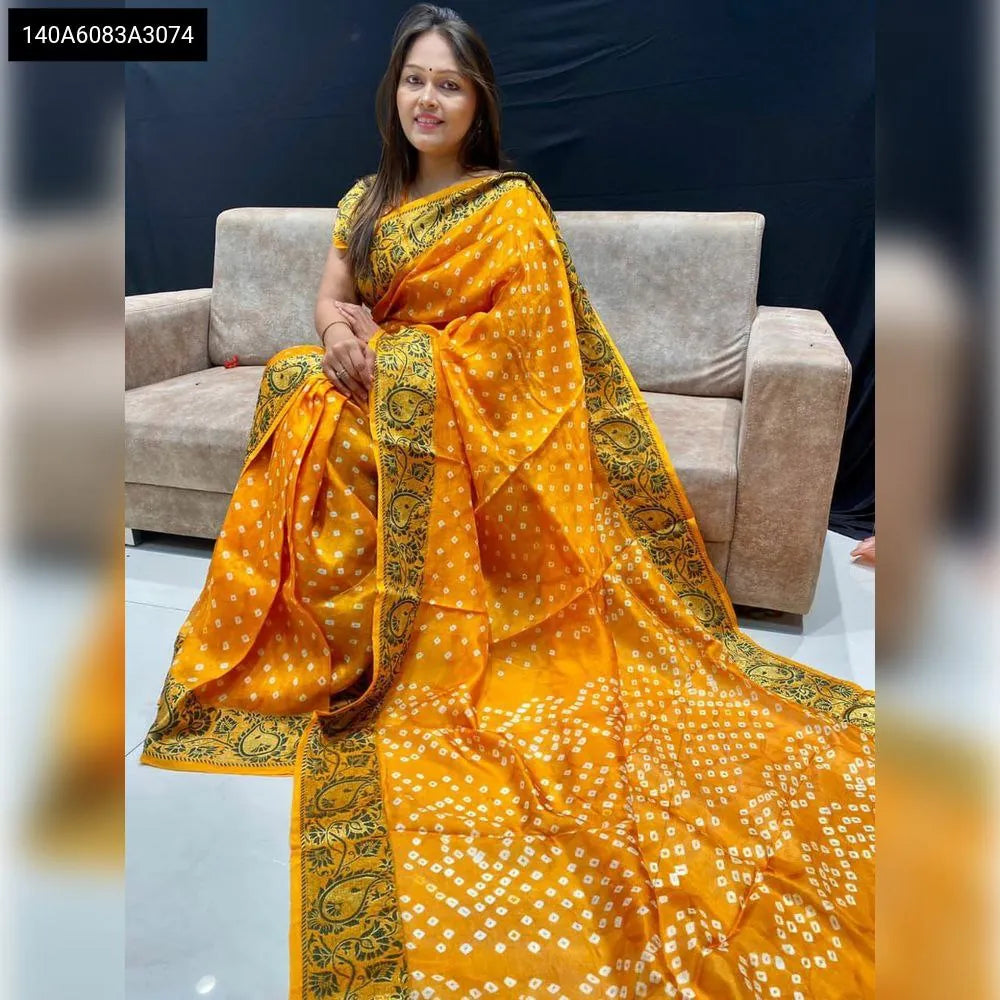Model wearing a vibrant yellow Art Silk Bandhej Saree with Zari border from TRENDBUY.