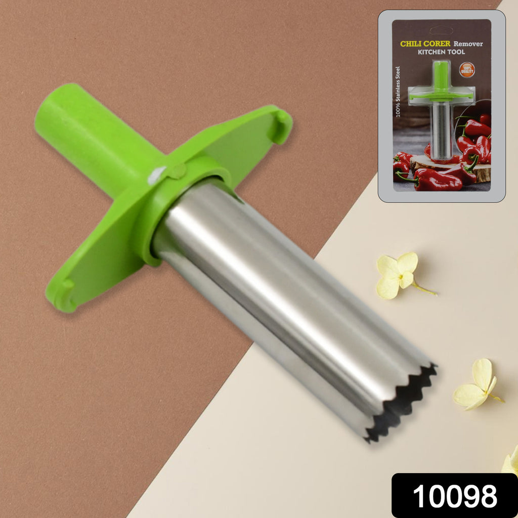 Small stainless steel chili corer remover kitchen tool being used to deseed a red chili pepper.