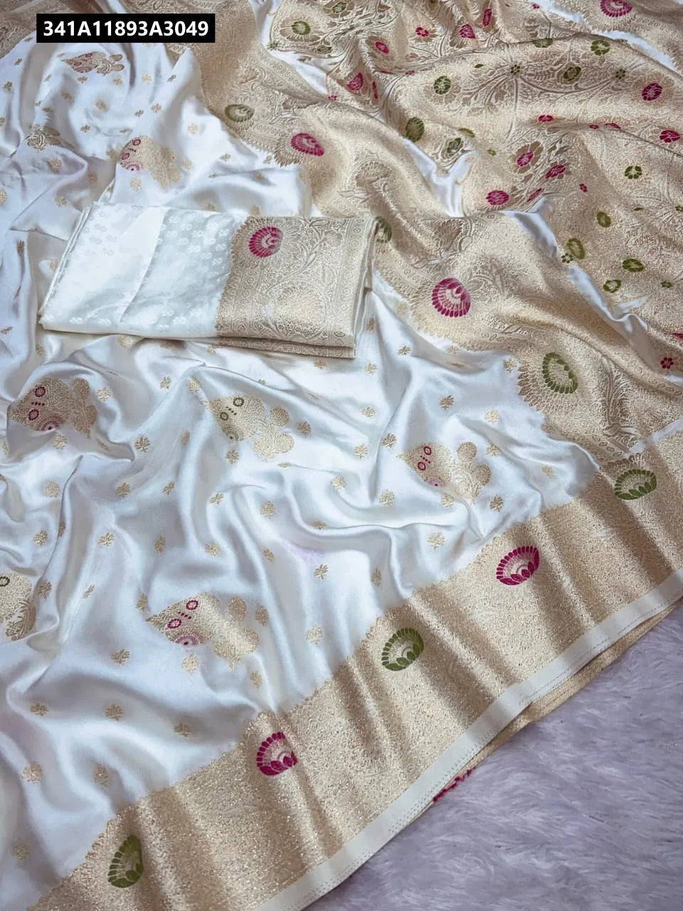 TRENDBUY Pure Banarasi Crepe Sartin Silk Saree in Ivory, showcasing exquisite zari woven pallu and fancy border, flat lay view.