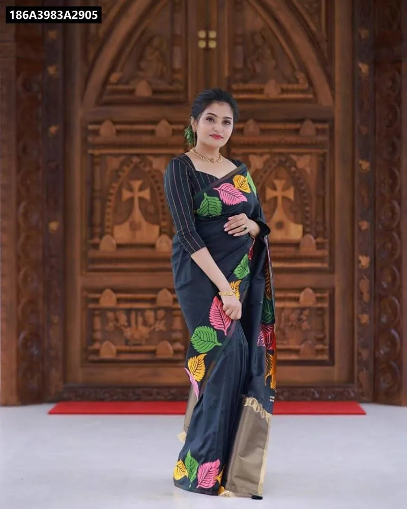 Full body view of a woman wearing TRENDBUY's Black Banarasi Soft Silk Saree with vibrant leaf print.