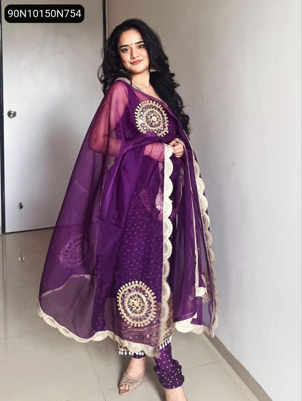 Model in vibrant purple Bandhani Faux Georgette Kurti Set with intricate mirror and pearl work, full body