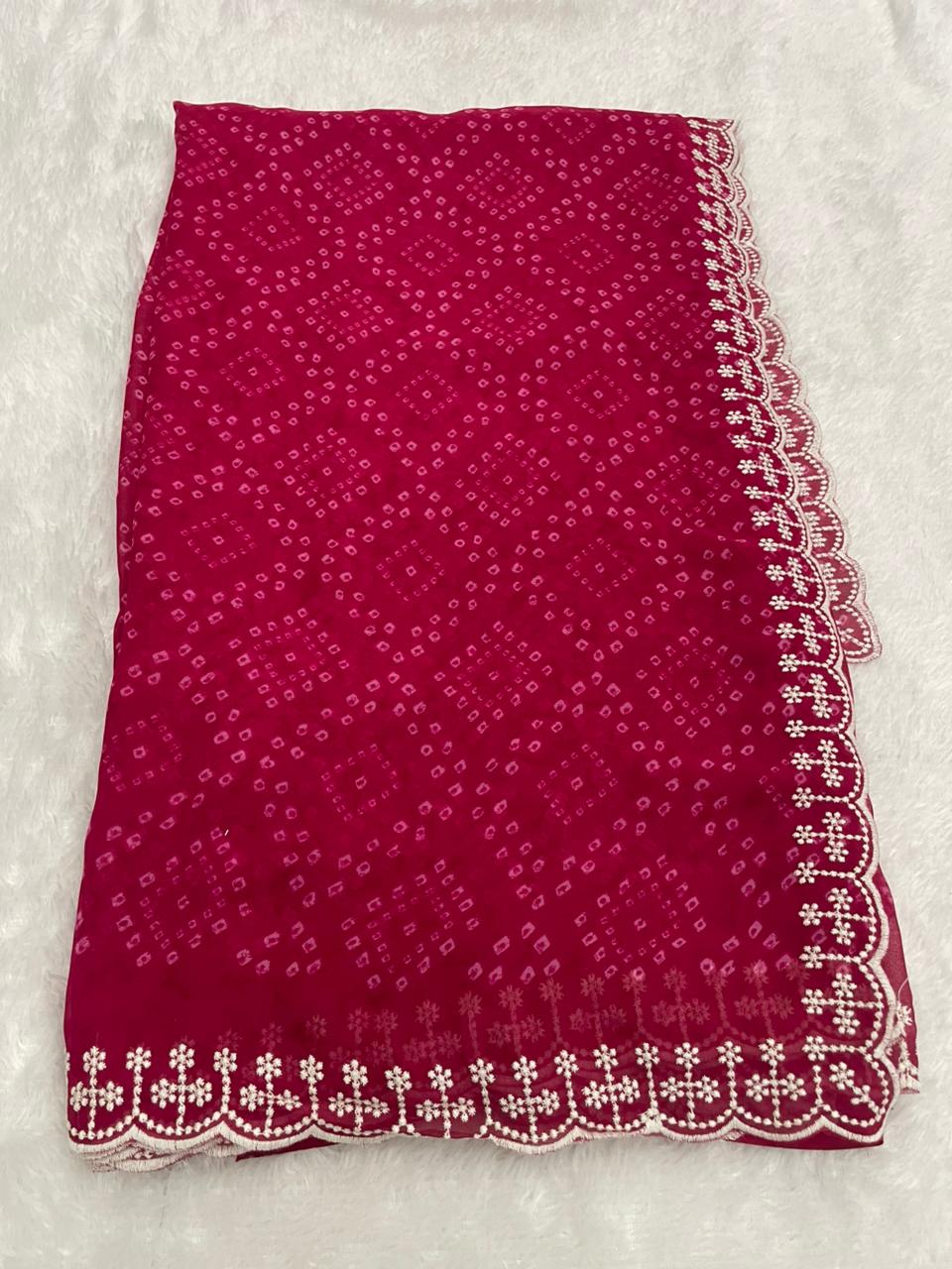 Magenta Bandhani Georgette Saree with intricate white embroidered border