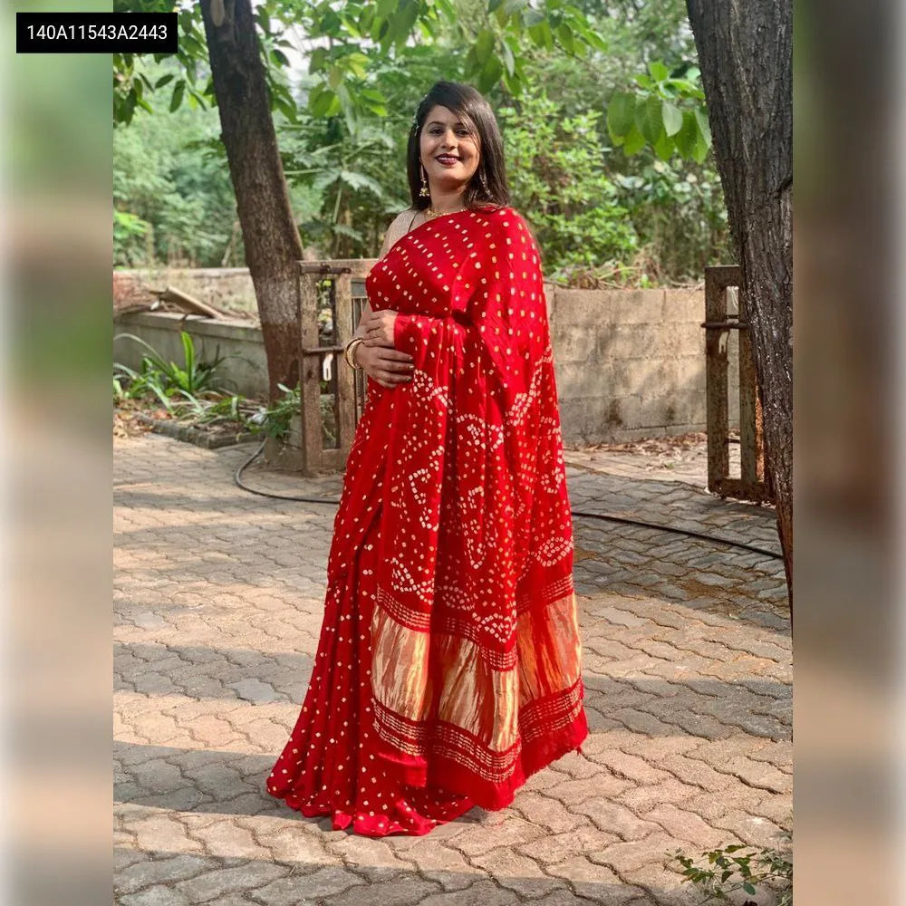 Front view of a woman gracefully draped in a Red Bandhani Gaji Silk Saree, ideal for festive occasions.