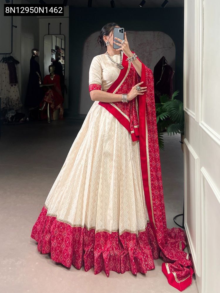 Model in Cream and Red Bandhej Print Lehenga Choli with red dupatta, full length, front facing pose.
