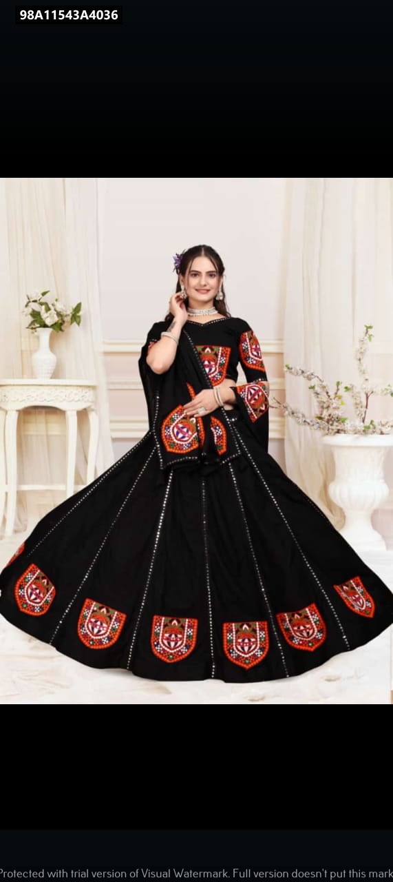 Beautiful model showcasing TRENDBUY Black Gamthi Mirror Work Lehenga, front pose, smiling.