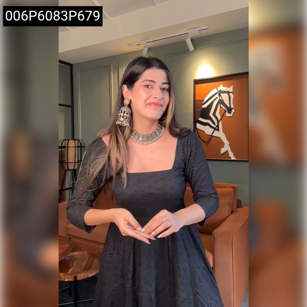 Woman posing in Black Hakoba Square Neck Anarkali Suit with silver jewelry