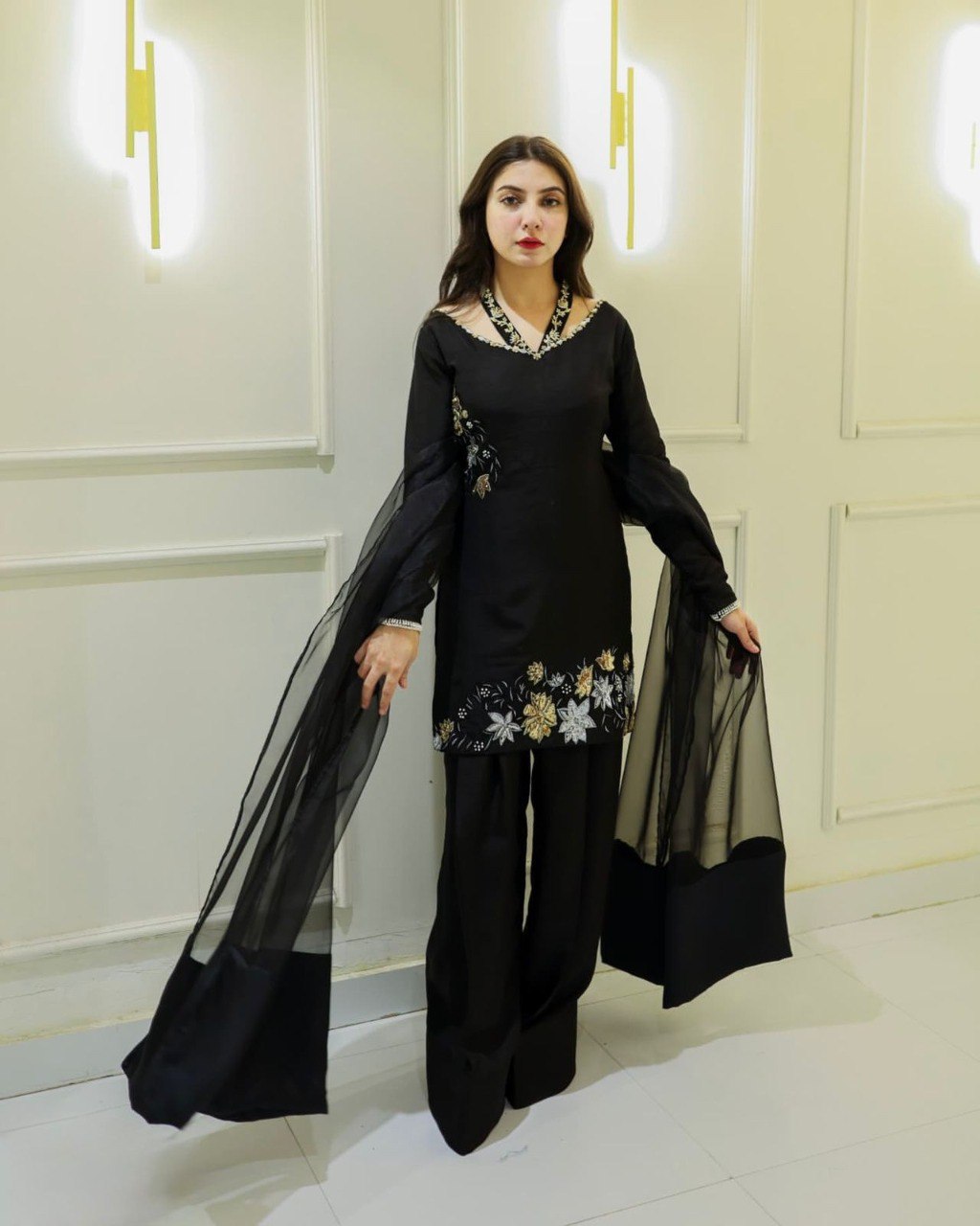 Model wearing black natural crepe silk embroidered kurta set with tissue silk dupatta, front view