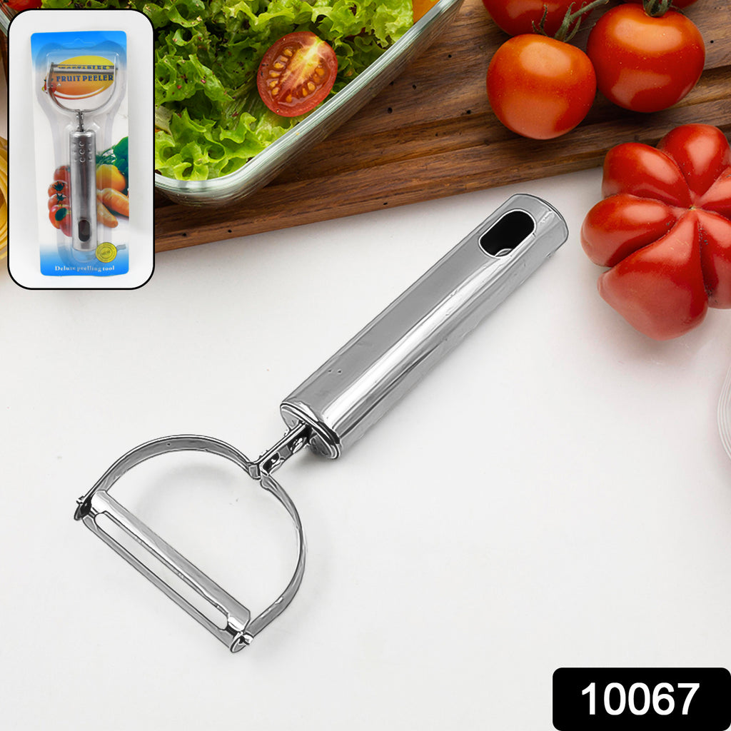 Stainless steel swivel fruit & vegetable peeler efficiently peeling a green cucumber.