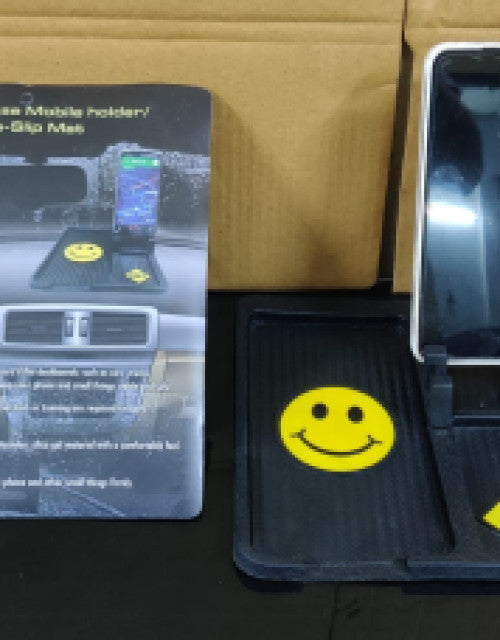 Multipurpose car dashboard non-slip mat securely holding a smartphone.