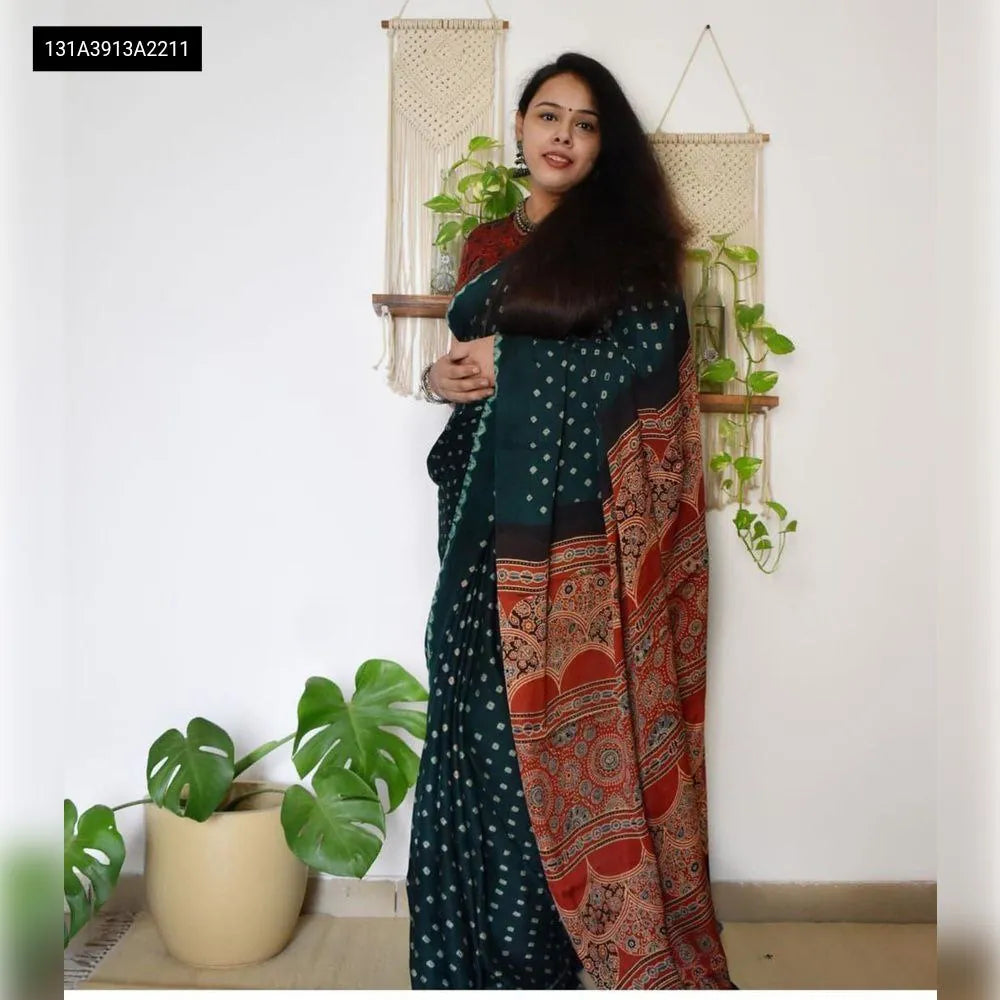 Woman in deep green Chanderi cotton digital print saree with red details, front-facing shot.
