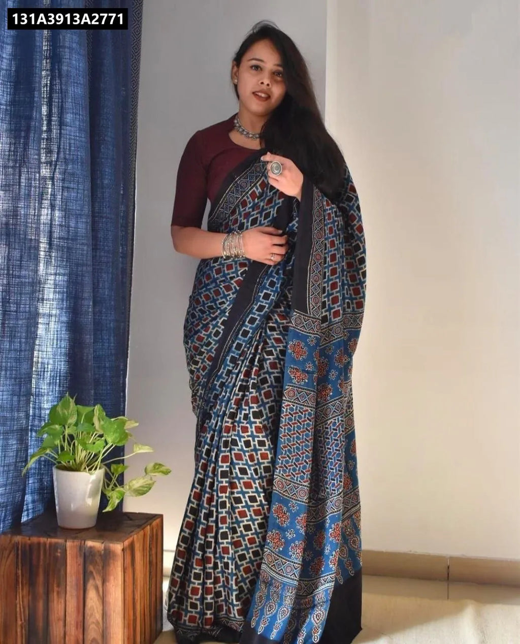 Model wearing Ocean Blue Chanderi Cotton Digital Print Saree with maroon blouse, front facing.